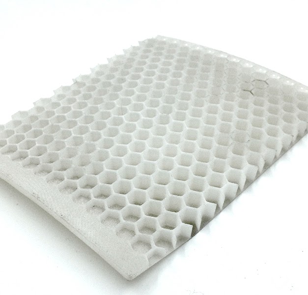 Honeycomb lattice panel made from PA12 GF40 nylon demonstrating rigidity and structure