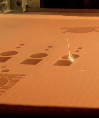 Selective Laser Sintering setup with scanning laser and nylon powder bed